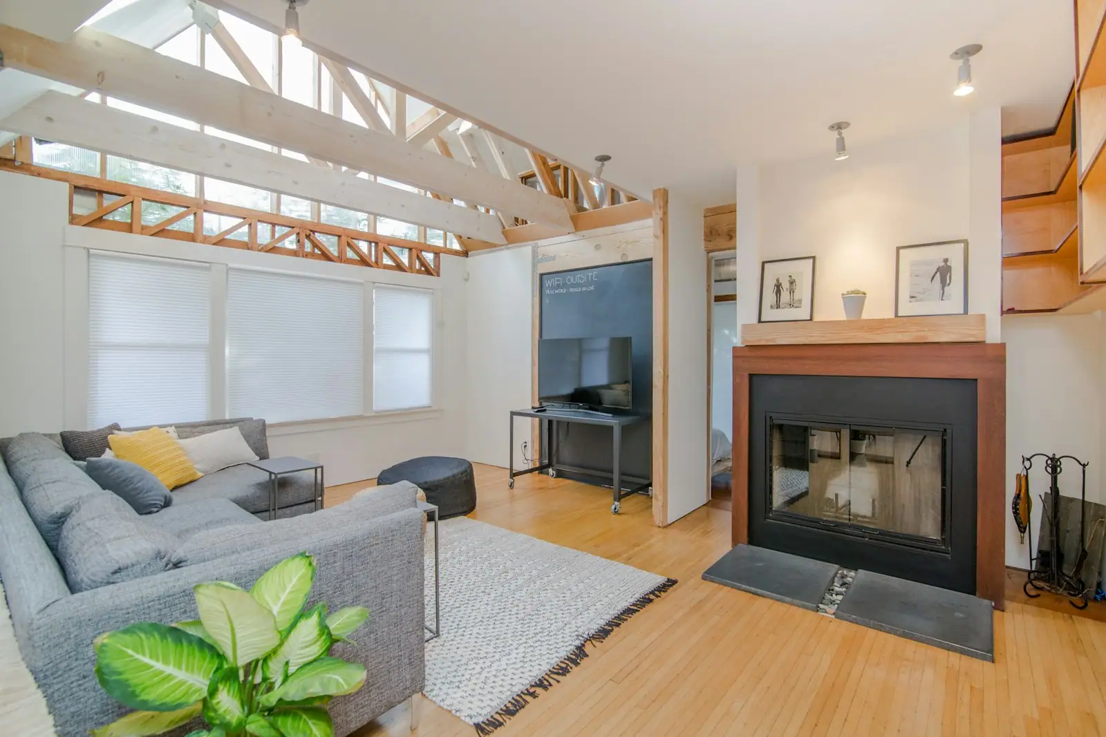 Living room with fireplace and skylights