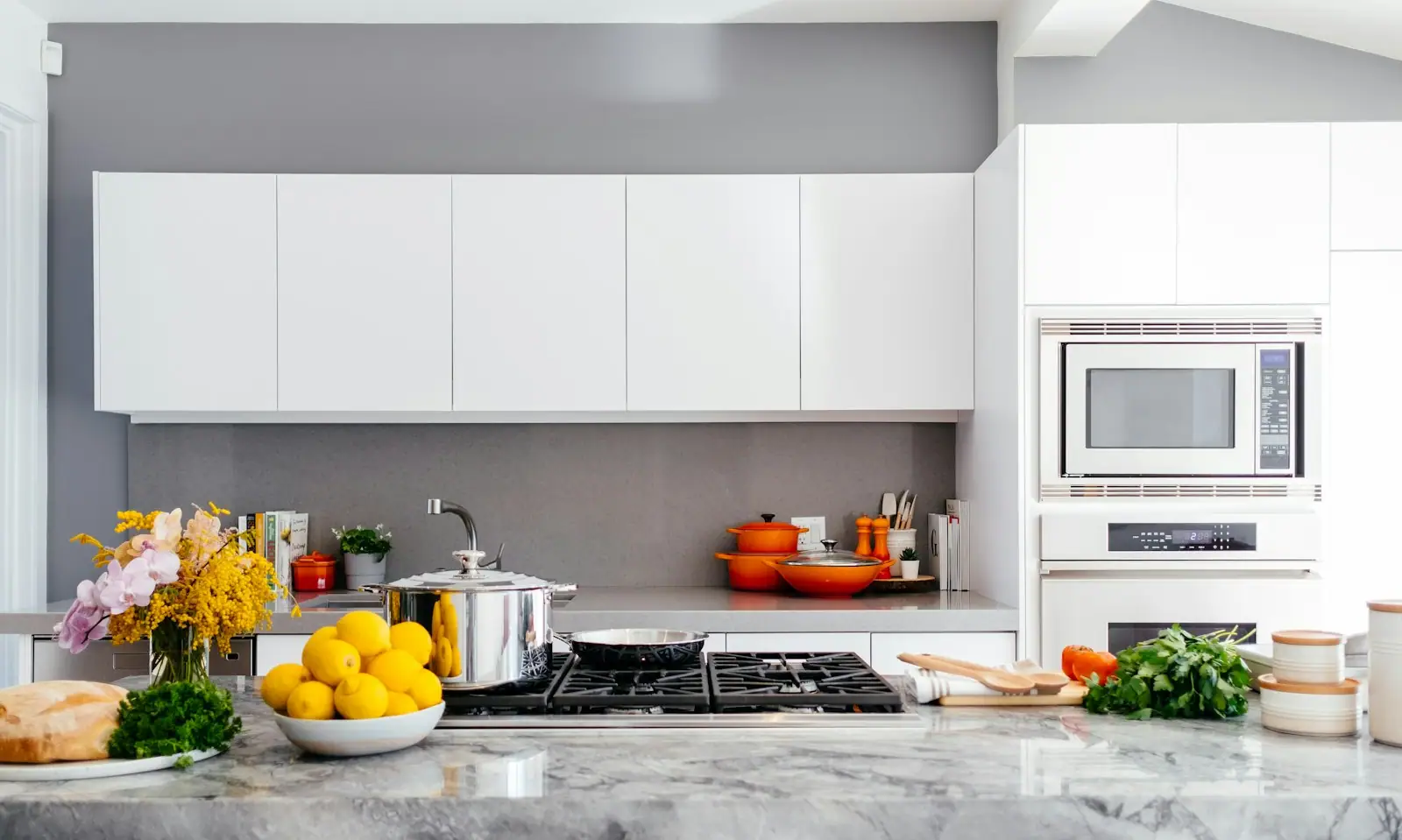 Marble countertop and white cabinetry in a remodeled kitchen