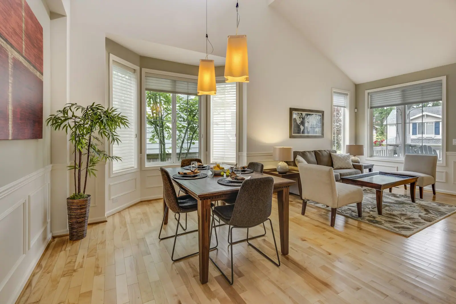 Dining room with a bay window and pendants