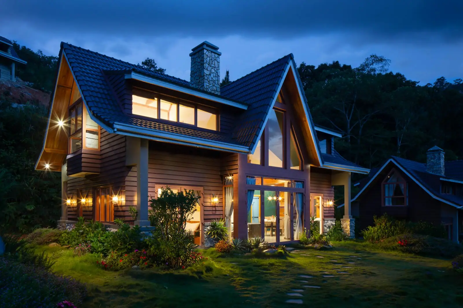 Louisville home at dusk with warm interior lighting