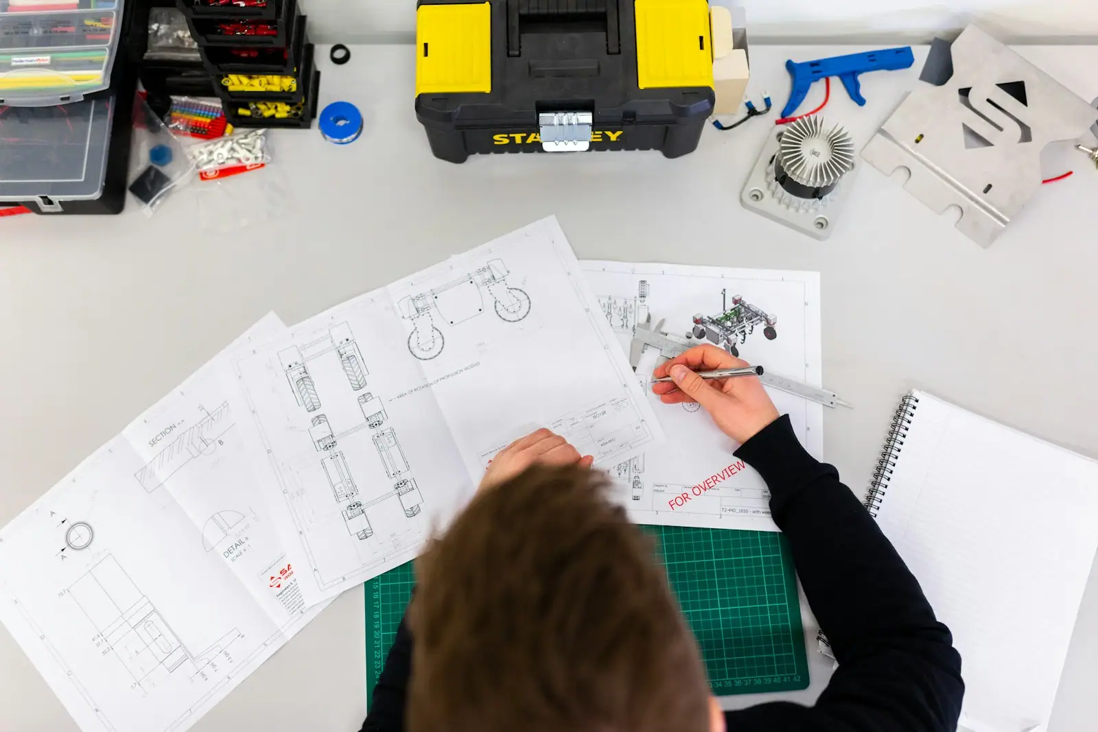 Designer reviewing drawings and samples