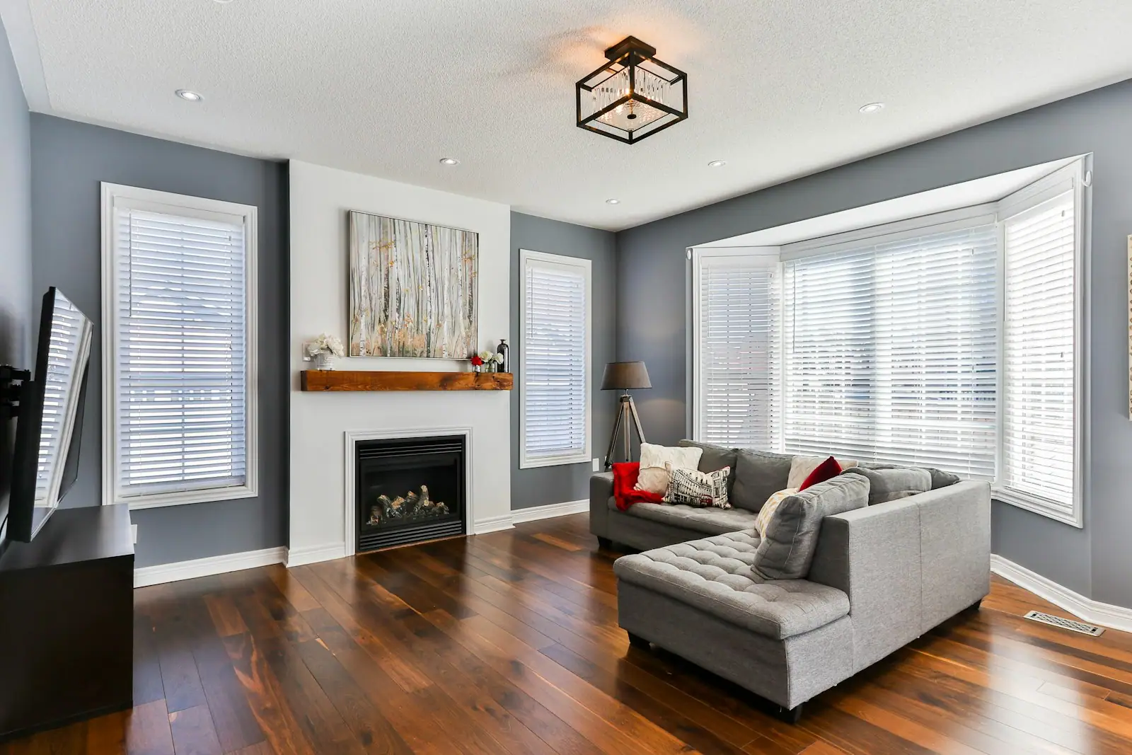 Family room with fireplace, hardwood floors and sectional