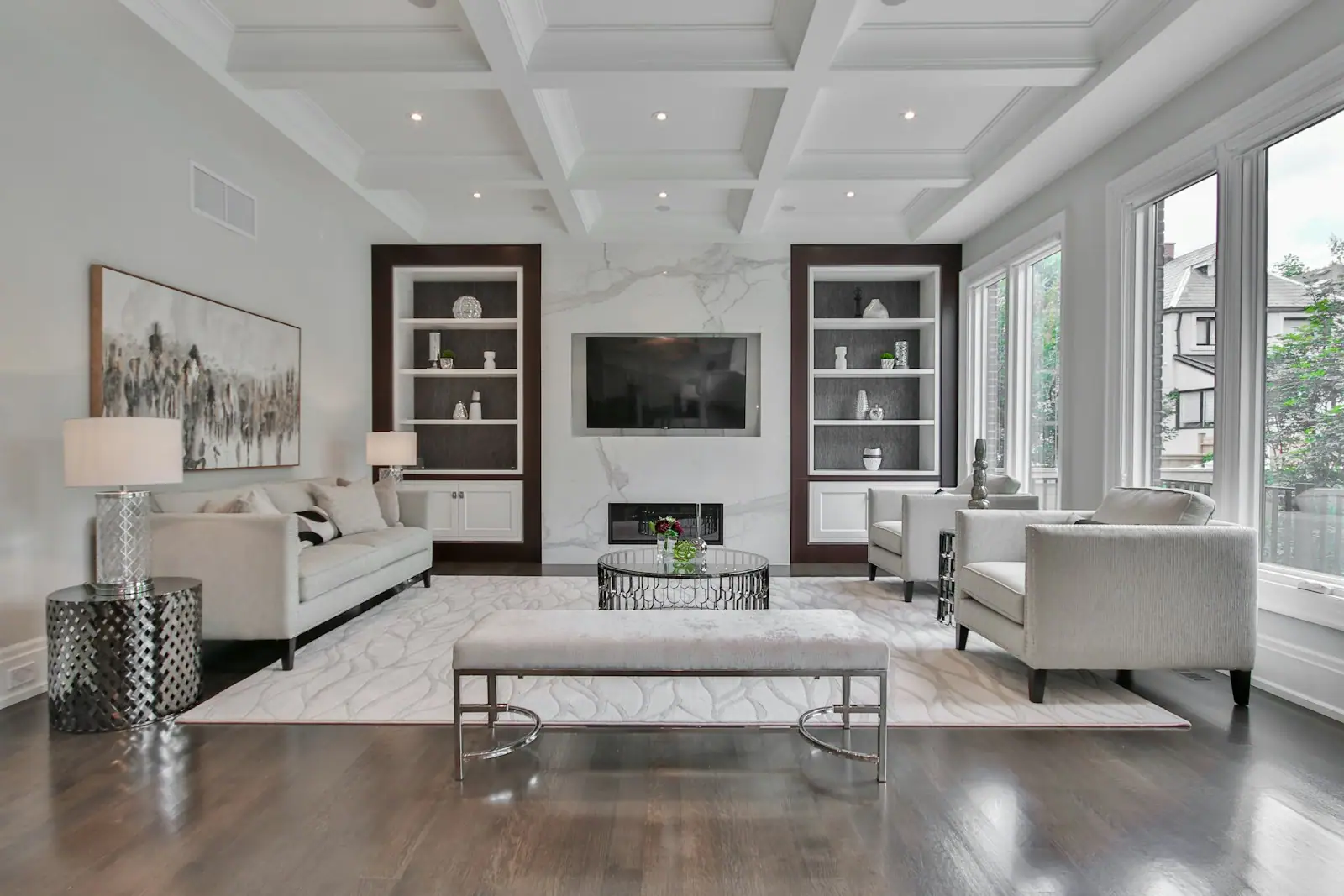 Living room with coffered ceiling and built-in bookcases