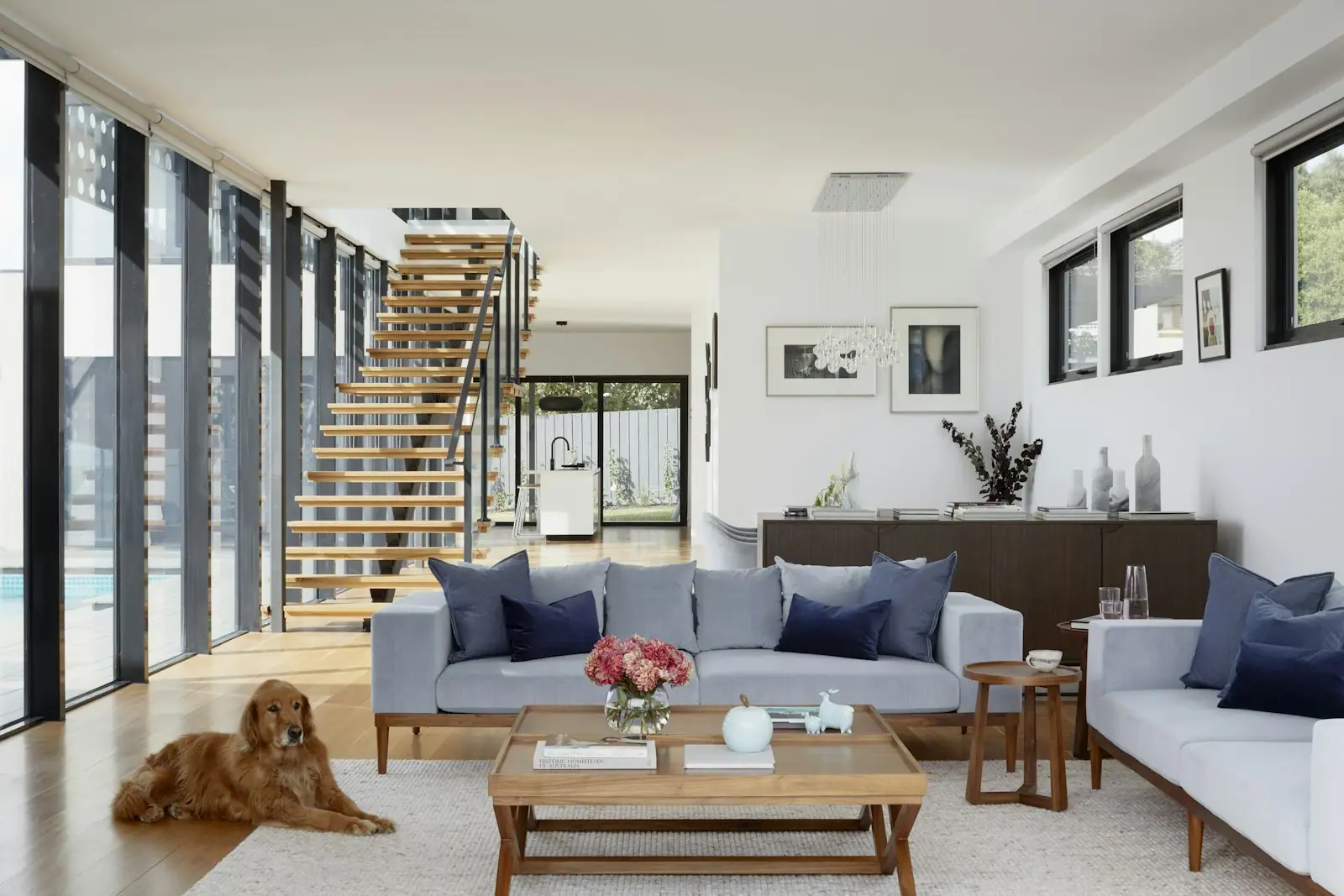 Open-plan living room with an open-tread stair